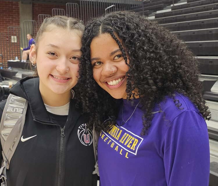 Brooklynn Haywoood, a sophomore at Union, and Columbia River coach Tee Anderson share a moment prior to Wednesday’s game. Anderson, a former Union Titan, used to coach Haywood in youth ball. Haywood is on pace to break Anderson’s Union record for points scored in a career. Photo by Paul Valencia