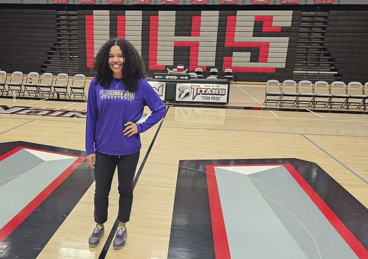 Tee Anderson stands at center court at Union High School. Anderson is the head coach of the Columbia River girls basketball team. A school counselor in Vancouver Public Schools today, Anderson was a star at Union and still holds the program’s record for points scored in a career. Photo by Paul Valencia
