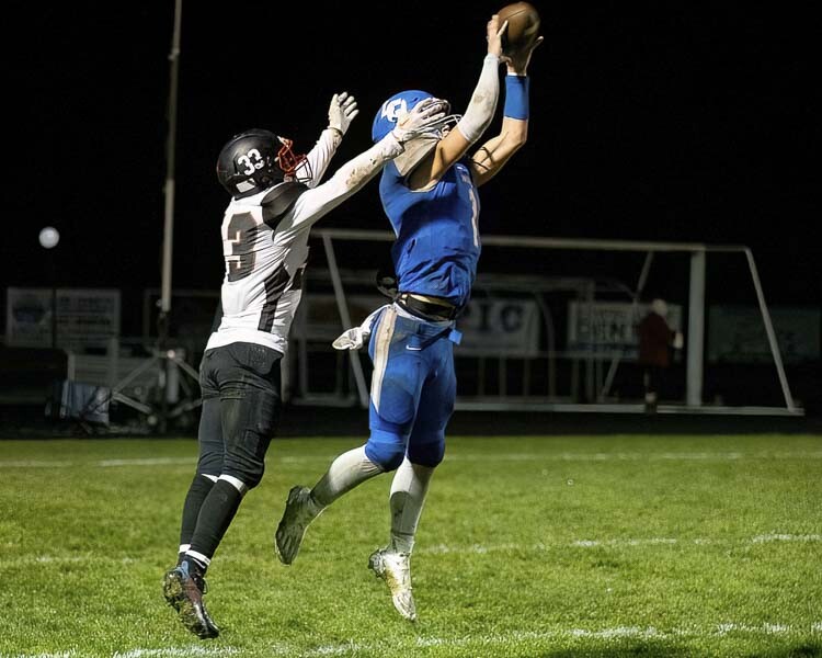 Houston Coyle not only plays quarterback for La Center, he also excels on defense. Here he is with an interception to end an Omak scoring threat. Photo by Mike Schultz