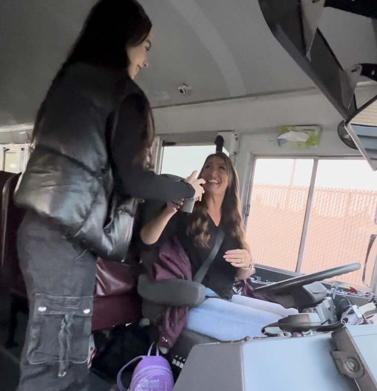 WHS student Chloe Cianni gives cocoa to bus driver Abby Johnson. Photo courtesy Washougal School District