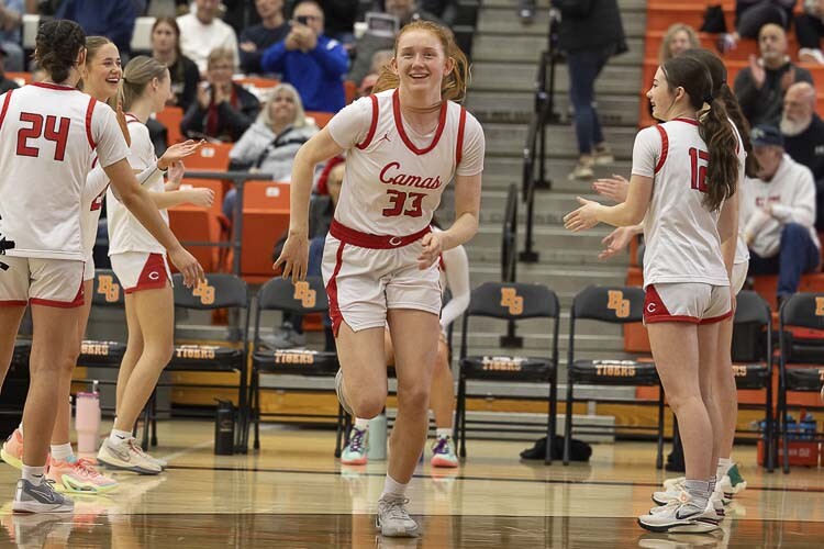 Camas senior Addison Harris (33) plays the game of basketball with a great deal of joy. Photo by Mike Schultz