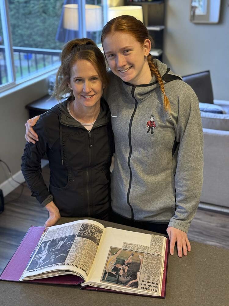 Camas standout Addison Harris (on right) finally got a chance to look at her mother Carla’s high school basketball scrapbook. Photo courtesy of the Harris family 
