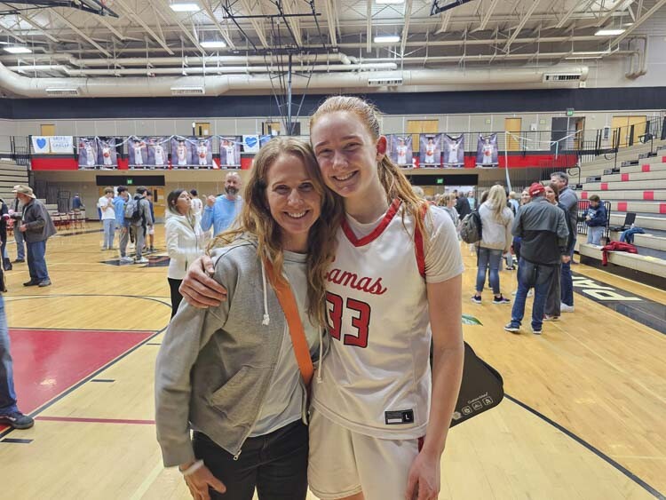 Carla Idsinga Harris (left) poses with daughter Addison Harris after a recent game at Camas High School. Photo by Paul Valencia