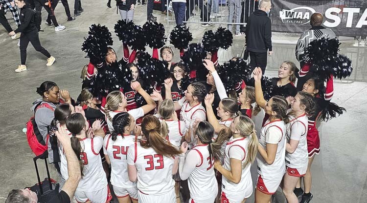 The Camas girls basketball team sings the school’s fight song with the Camas cheer squad Friday in the Tacoma Dome. Photo by Paul Valencia