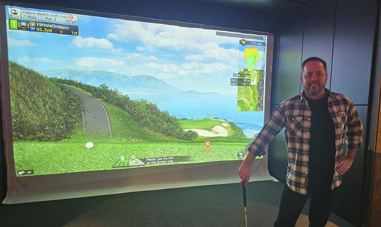 Among the fun items that Current Home Technologies has to offer is the GolfZon golf simulator. Tony Curtis even created a spin-off business, if you will, with the 19th Hole on Main, as the office of Current Home Technologies in Vancouver. Photo by Paul Valencia