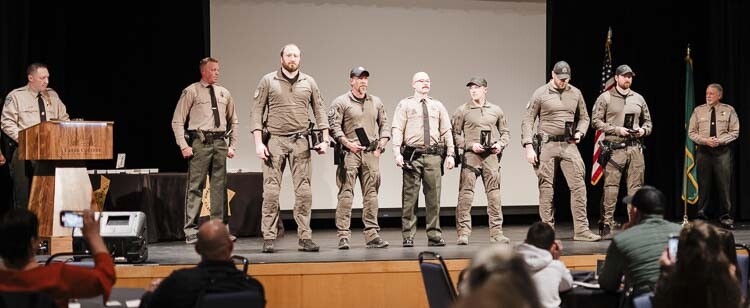 Dep. Drew Kennison with Life-Saving Award Recipients. Photo courtesy Clark County Sheriff’s Office