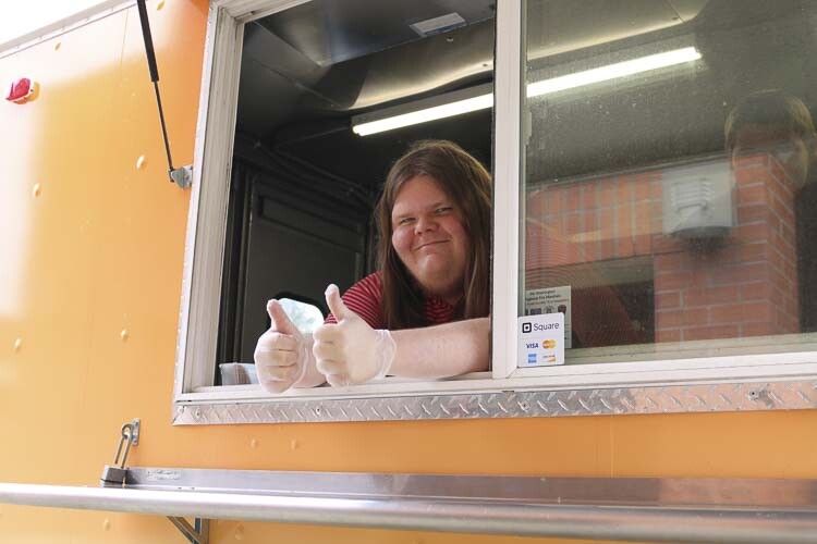 Joseph Yantis serves fresh food out of the Shoug Shack food truck. Photo courtesy Washougal School District