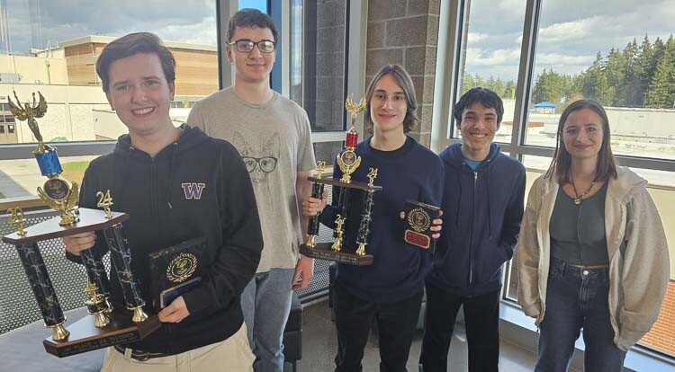 The Knowledge Bowl team from Ridgefield High School won regionals recently and later this week will be going for its third consecutive state championship. Pictured from left to right are: Adam Ford, Stuart Swingruber, Asher Anderson, James Haddix, and Emiliana Newell. Photo by Paul Valencia
