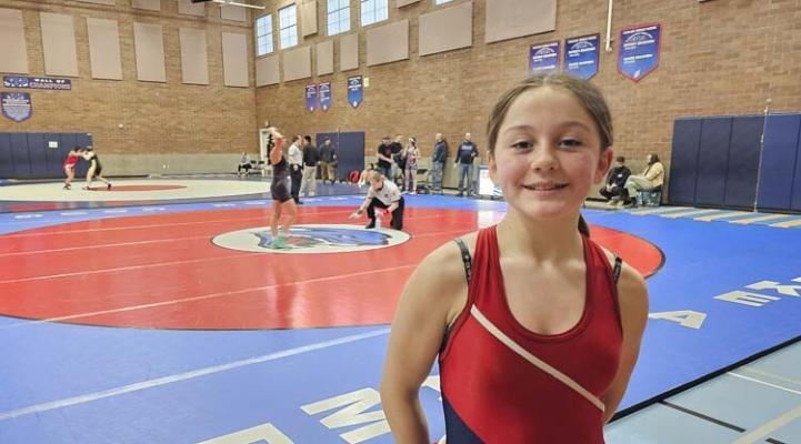 Stella Rickard, a seventh-grader at Cascade Middle School, said she is having fun as a wrestler. She appreciates that her school hosts a girls-only wrestling tournament every year. Photo by Paul Valencia