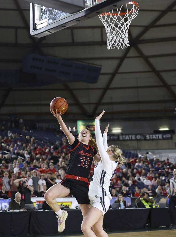 Camas senior Addison Harris (33) drives for a basket in the first half of the Class 4A girls’ basketball state championship game Saturday at the Tacoma Dome. Photo courtesy Mike Schultz
