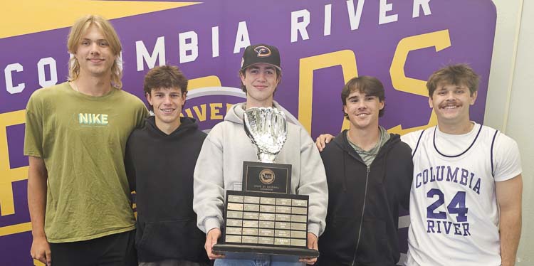 Columbia River baseball players Noah Coakes, Charlie Palmersheim, Cole Backlund, Zach Ziebell, and Chris Parkin pose with the state championship trophy earlier this week. Photo by Paul Valencia