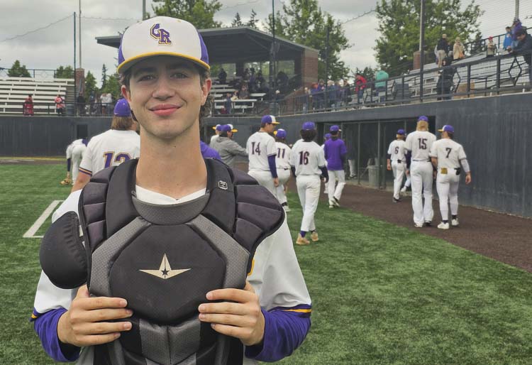 Cole Backlund of Columbia River baseball has inspired his coaches and teammates with his dedication to improving his skills as a catcher. He has helped the Rapids reach the state semifinals. Photo by Paul Valencia