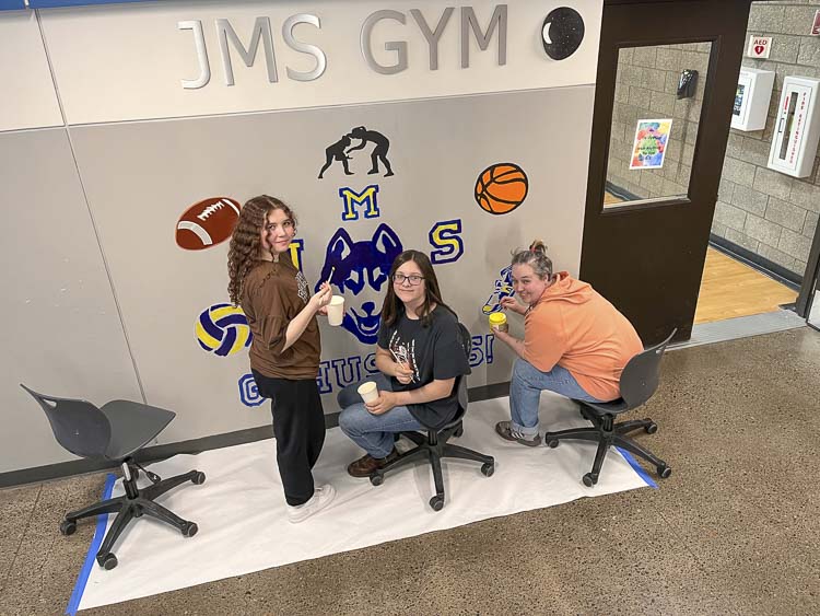 Students Rylee Drake, Aubrey Gale, and teacher Dani Allen paint mural. Photo courtesy Washougal School District