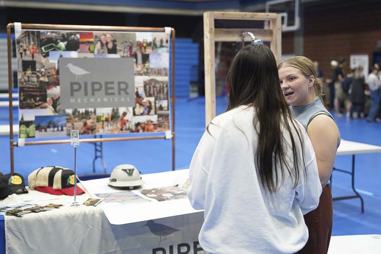 Students speak with reps from Piper Mechanical, a full mechanical company in Vancouver. Photo courtesy Hockinson School District