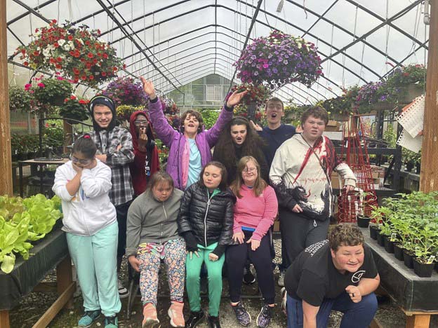 -Washougal High School students at Hayes Family Growers. Left to right, first row: Blake Early, Jason Meulton, Ava Campbell, Charles Jeter, Evan Minor, Wyatt McGuire. Second row: Alexandra Antonova, Kayla Berry, Sarah-Noelle Hare, Suzanne Brown and Nicholas Maloney. Photo courtesy Washougal School District