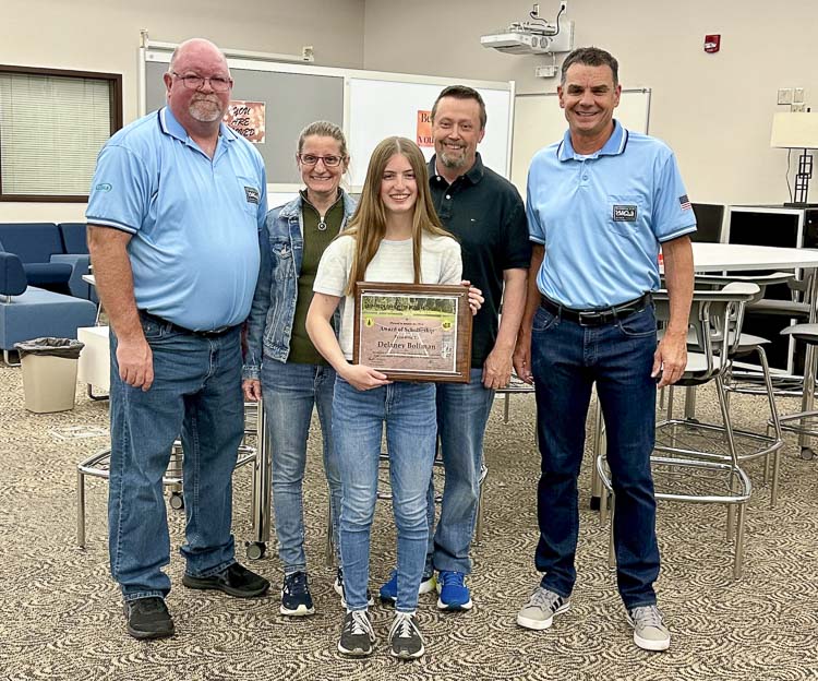 Delaney Bollman of Evergreen High School accepts a scholarship from the Evergreen Fast Pitch Officials Association. Photo courtesy of the EFPOA