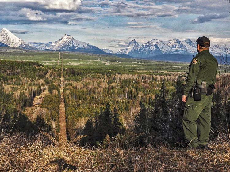 A Border Patrol agent standing watch at the Montana-Canada border in the CBP Spokane Sector. The Spokane Sector covers the U.S.-Canada border along the northwestern section of Montana, part of Idaho, and the eastern part of Washington. Photo courtesy U.S. Customs and Border Protection