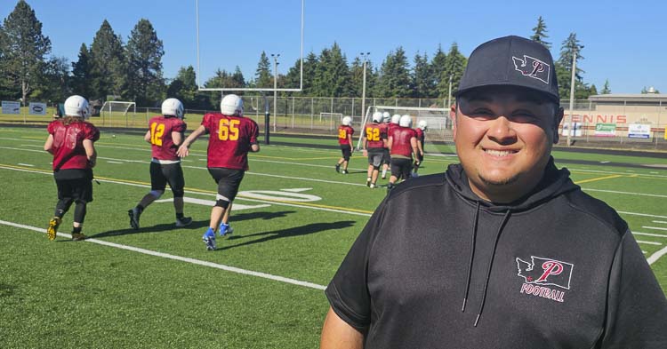 Junior Miller, a 2002 graduate of Prairie High School, is thrilled to have the opportunity as the head coach of Prairie football. Photo by Paul Valencia