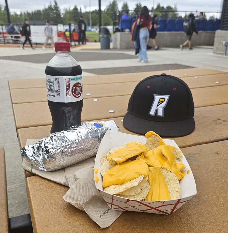 The Ridgefield Raptors have deals all season long on $3 Tuesdays. A soda, a hot dog, and a serving of nachos, for $3 each. Plus general admission tickets are $3. For the record, the Raptors hat is not part of the deal. Photo by Paul Valencia