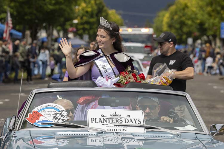 Nora Taylor, who was crowned Miss Woodland on Thursday, enjoys her ride in Saturday’s parade at Planters Days. Photo by Mike Schultz