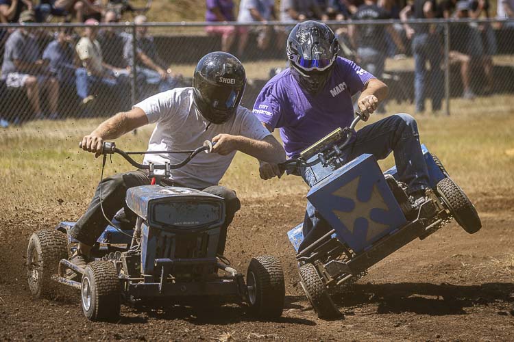 Chris Waters and Marty Ebert battled it out last year during lawnmower racing at Territorial Days. Photo by Mike Schultz