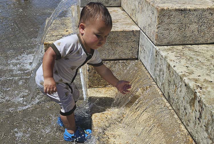 Nothing like a water feature on a hot day for Ridgefield’s Kahuapaa Kaahanui. The water feature at Vancouver’s Waterfront Park will be very popular as temperatures are expected to hit triple digits. Photo by Paul Valencia