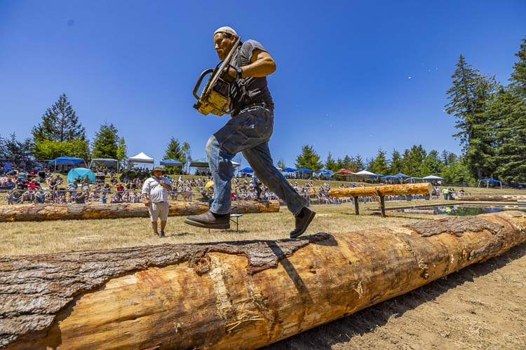 Ben Goble keeps his balance while competing in the Log Show at Territorial Days on Saturday. Photo by Mike Schultz