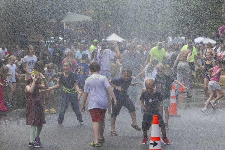 Water, water everywhere, and that meant a time to dance for a lot of children at Camas Days. Photo by Mike Schultz