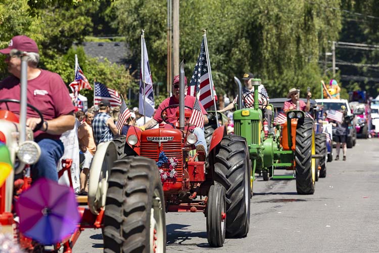 From new equipment to old, the parade had a lot of everything. Here, the Fort Vancouver Antique Equipment Association rolled into Ridgefield. Photo by Mike Schultz