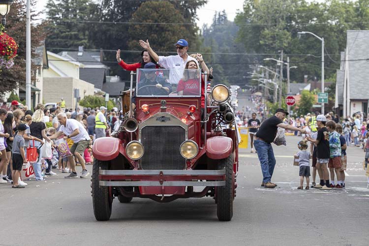 City council members role this 1929 fire truck during the Camas Days parade. Photo by Mike Schultz