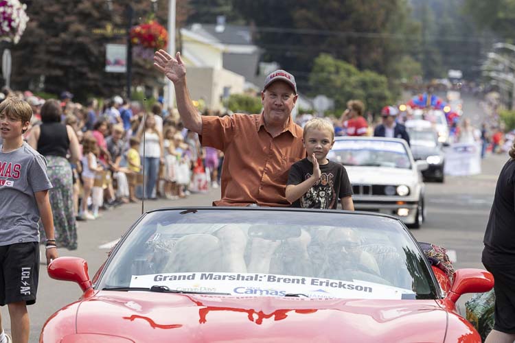 Brent Erickson, the grand marshal of the Camas Days Parade, had his grandson Silas Butterfield along for the ride during the parade. Photo by Mike Schultz