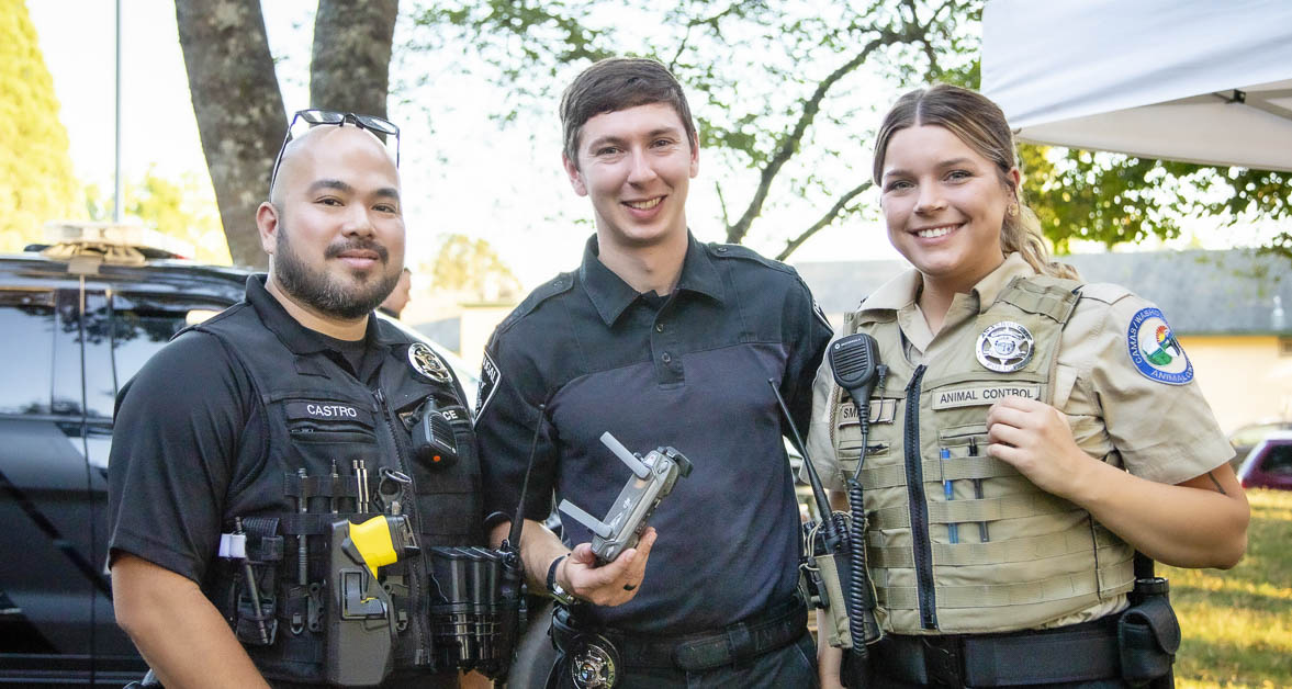Officers Ryan Castro and Trevor Claudson and Animal Control Officer Virigina Smith at National Night Out in Washougal, WA. Photo by Michele Loftus, courtesy city of Washougal.