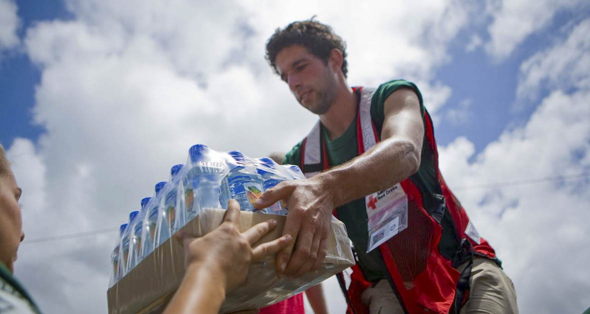 An American Red Cross volunteer is shown here working in the heat. Photo courtesy American Red Cross