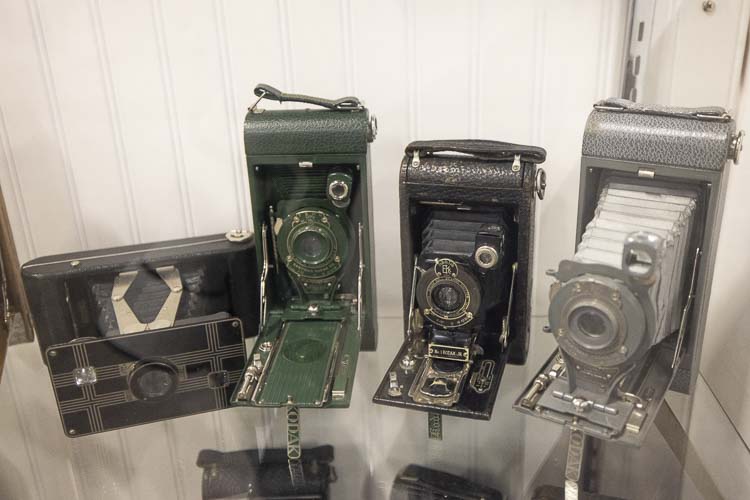 Here are four of close to 100 items of antique cameras that are on display at the Clark County Fair. Photo by Mike Schultz