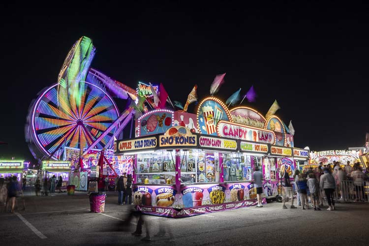 The Clark County Fair looks magical when the sun goes down, with all the lights at the carnival. Photo by Mike Schultz