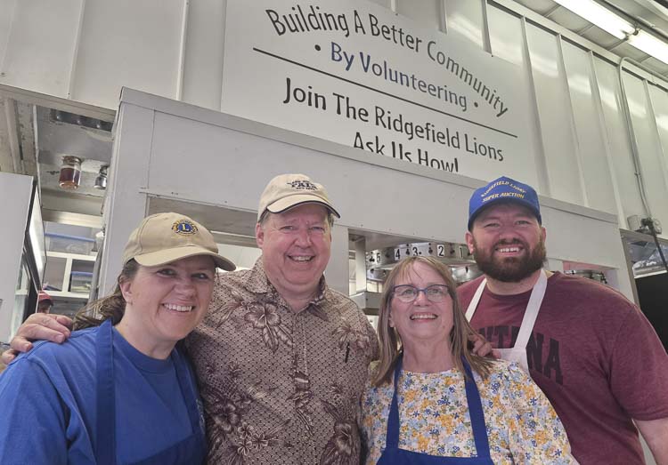 Don and Sandy Lasher, middle, with their daughter Lindsey and son Jeff have always made it a family tradition to work the Ridgefield Lions Club food booth at the Clark County Fair. Photo by Paul Valencia