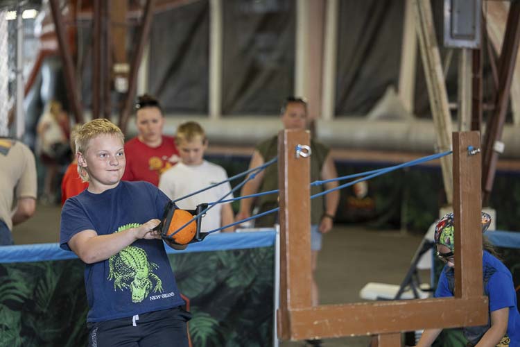 You’ve heard of Angry Birds? That’s nothing. Lucan Highfield of Vancouver enjoys his time playing Angry Pteranodons at the Clark County Fair. Photo by Mike Schultz