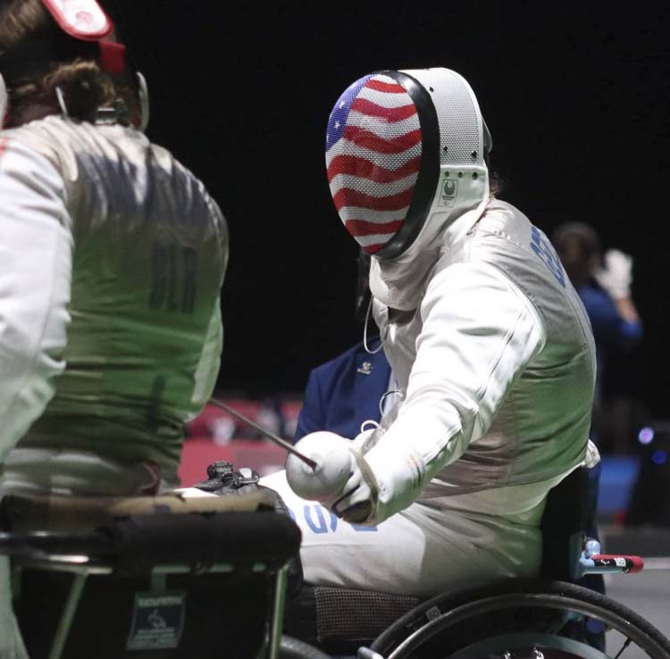 Ellen Geddes, a wheelchair athlete who trains at Orion Fencing in Vancouver, has a fun story regarding her introduction to the sport. Another fencer asked her if she would like to stab someone. Sure! Photo courtesy Ellen Geddes