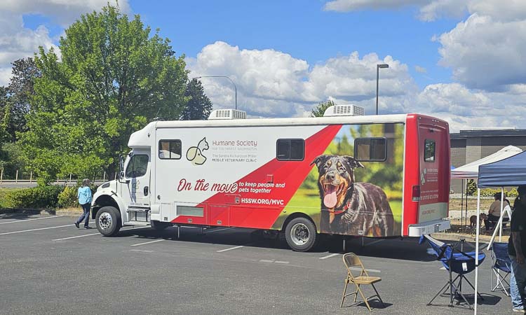 The mobile unit for the Humane Society for Southwest Washington was set up at the Thrive 2 Survive pop-up event in Battle Ground on Friday. People in need were not only getting free services for themselves, but also for their pets. Photo by Paul Valencia