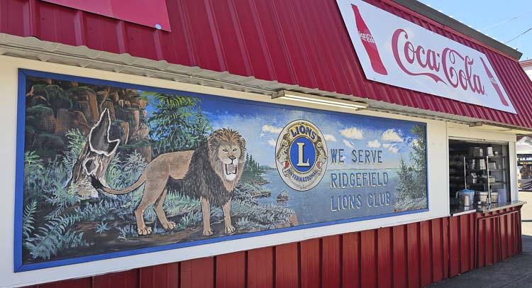 The Ridgefield Lions Club food booth has this mural on one of its walls, welcoming fairgoers for decades. Photo by Paul Valencia