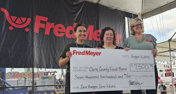 Fred Meyer donated $7,500 to the Clark County Food Bank at a presentation Friday at the Clark County Fair. Pictured are Emily Cook of Holt Homes, Rachel Beck of the Clark County Food Bank, and Tiffany Sanders of Fred Meyer. Photo by Paul Valencia