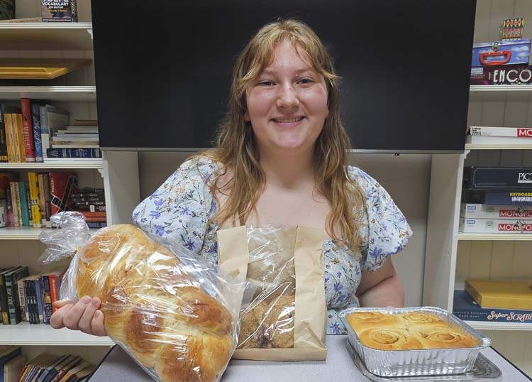 Toby Magyar, a senior at Columbia Adventist Academy, is baking goods such as challah bread, cinnamon rolls, and jams in order to raise funds for Bumi Sehat, a birthing center in Bali, Indonesia. Photo by Paul Valencia