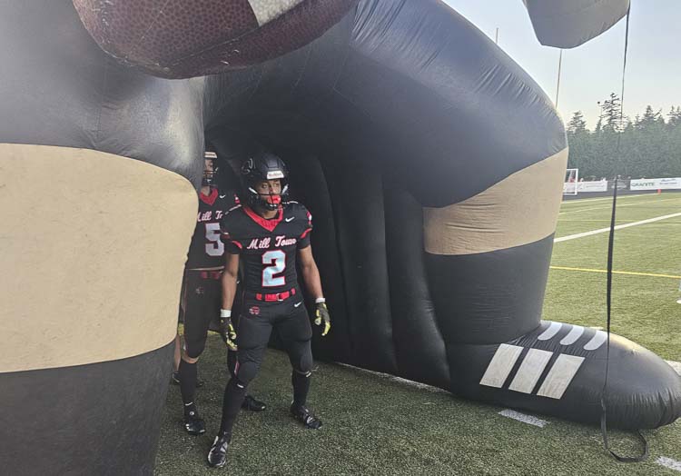 Titan Brody gets ready to be introduced Friday night prior to Camas’ football game against Oregon City. Brody and the Papermakers wore new uniforms, highlighting the community’s history. Photo by Paul Valencia