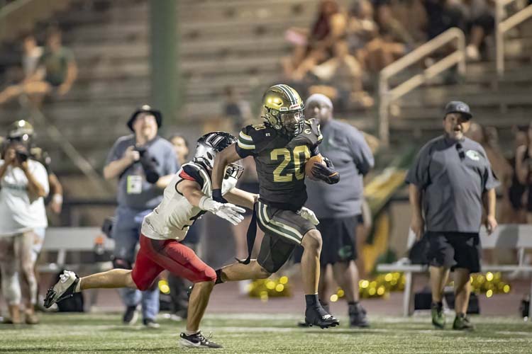 Raisean Chambers of Evergreen breaks free for a long gain Friday night in a win over Union. Photo courtesy Heather Tianen