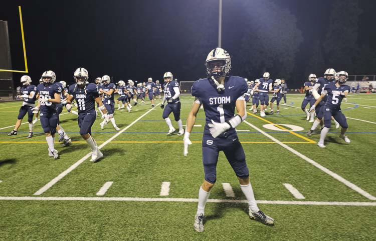 Micah Robison and the Skyview Storm warm up prior to the second half Friday night at Kiggins Bowl. The Storm never gave up hope and rallied from a 17-point deficit to beat Graham Kapowsin. Photo by Paul Valencia