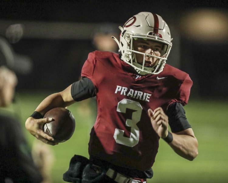 Prairie quarterback Deven Vigue had a touchdown run and three touchdown passes in the second half as the Falcons rallied to beat Battle Ground. Photo courtesy Chris Barker