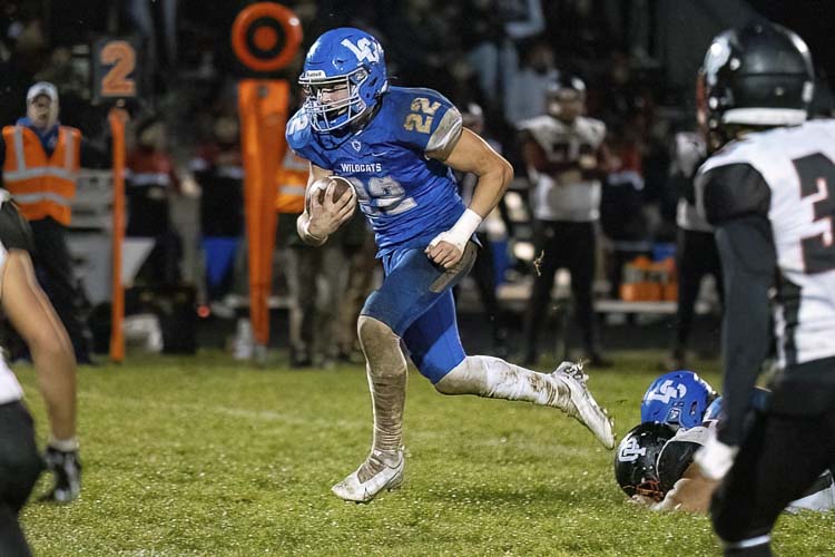 The always physical Isaac Chromey of La Center will be difficult to bring down. Photo by Mike Schultz