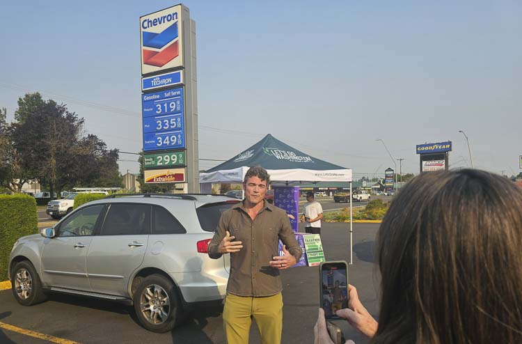 Joe Kent, the Republican nominee for Washington’s 3rd Congressional District, made a video for social media, promoting the Gas Rollback event in Vancouver on Friday. Photo by Paul Valencia