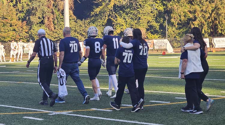 William “Liam” Sloan’s family brought Liam’s Skyview jersey to the coin flip ceremony prior to Saturday’s game against Richland at Kiggins Bowl. Photo by Paul Valencia