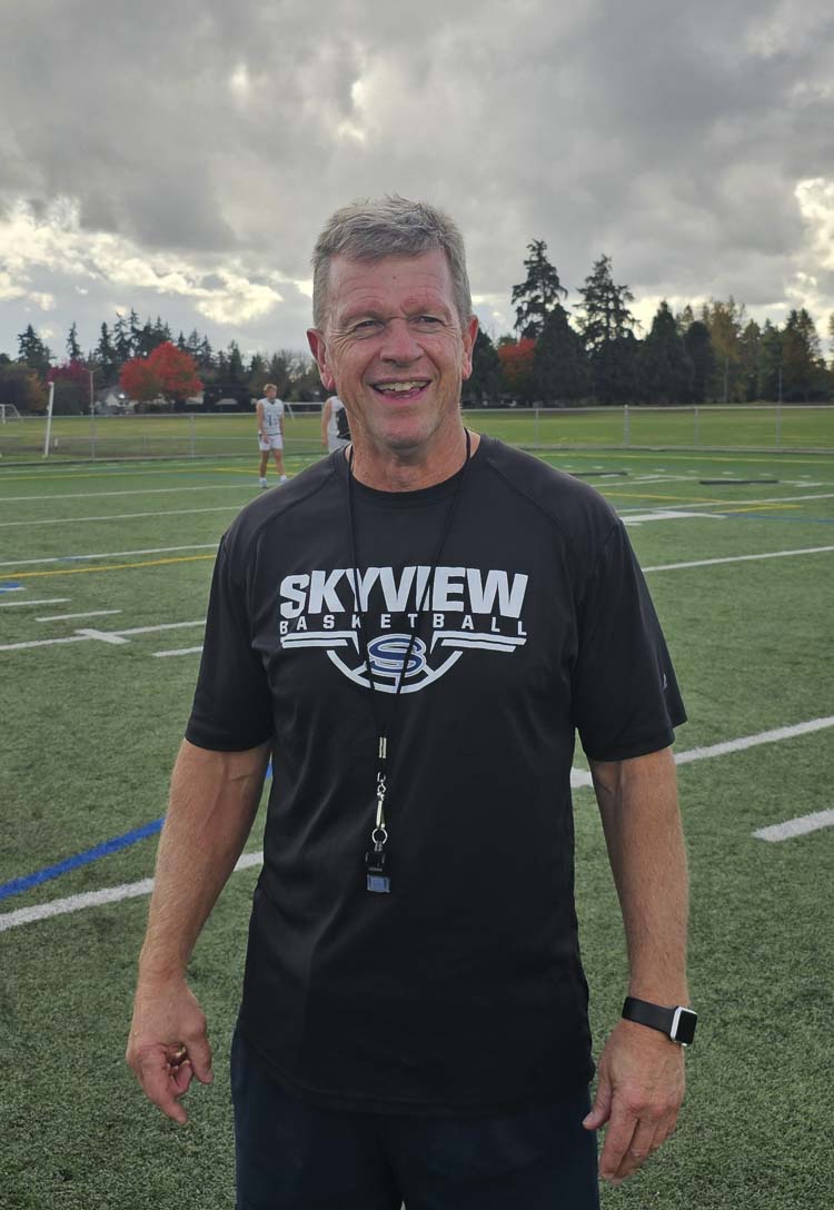 Yes, that is Skyview football coach Steve Kizer wearing a Skyview basketball shirt. That is fitting,though, because Kizer helped change the culture for all sports at Skyview during his tenure, according to Julian Williams, the school’s athletic director. Kizer announced he is retiring after this football season. Photo by Paul Valencia